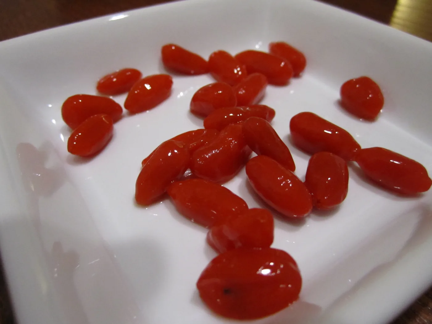A cluster of orange-red goji berries